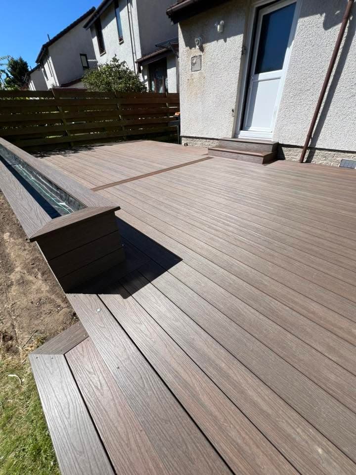 Composite decking build with glass balustrade by Greenwell