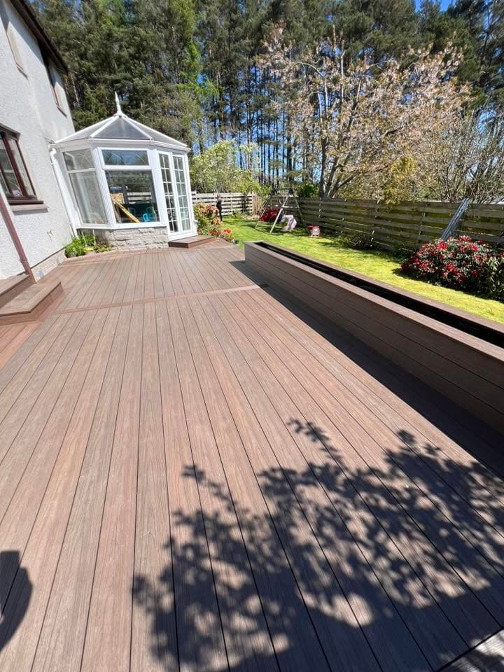 Composite decking build with glass balustrade by Greenwell