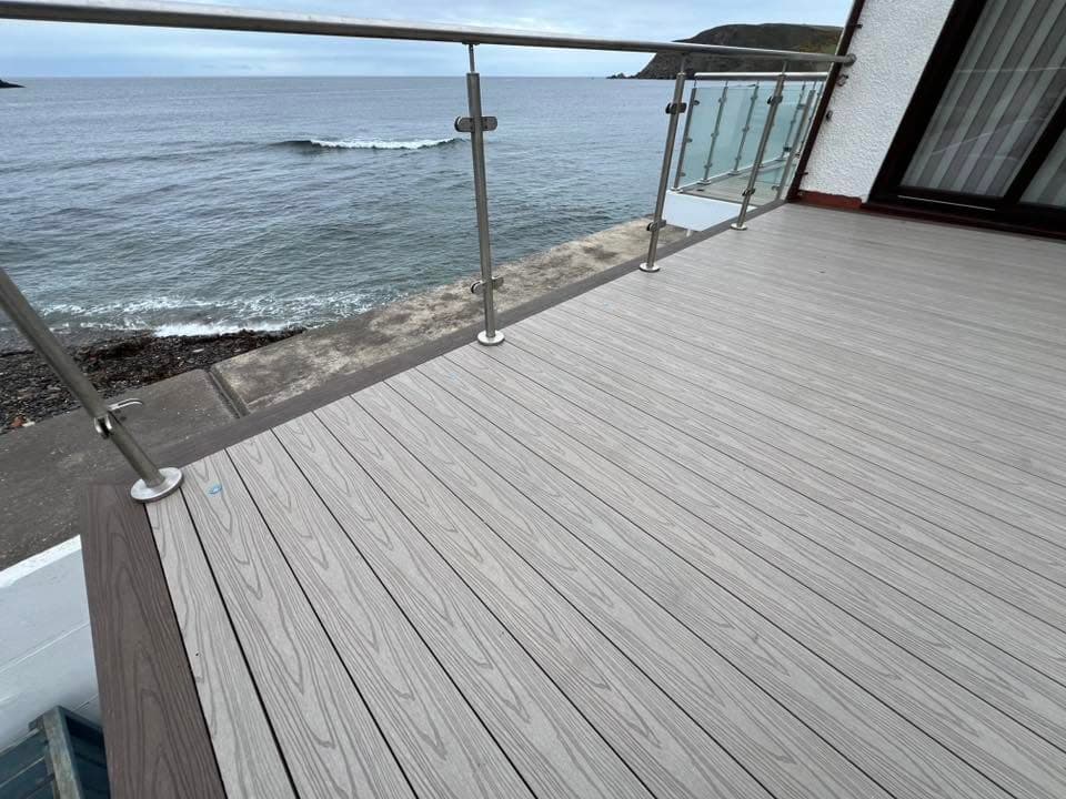 Composite decking build with glass balustrade by Greenwell