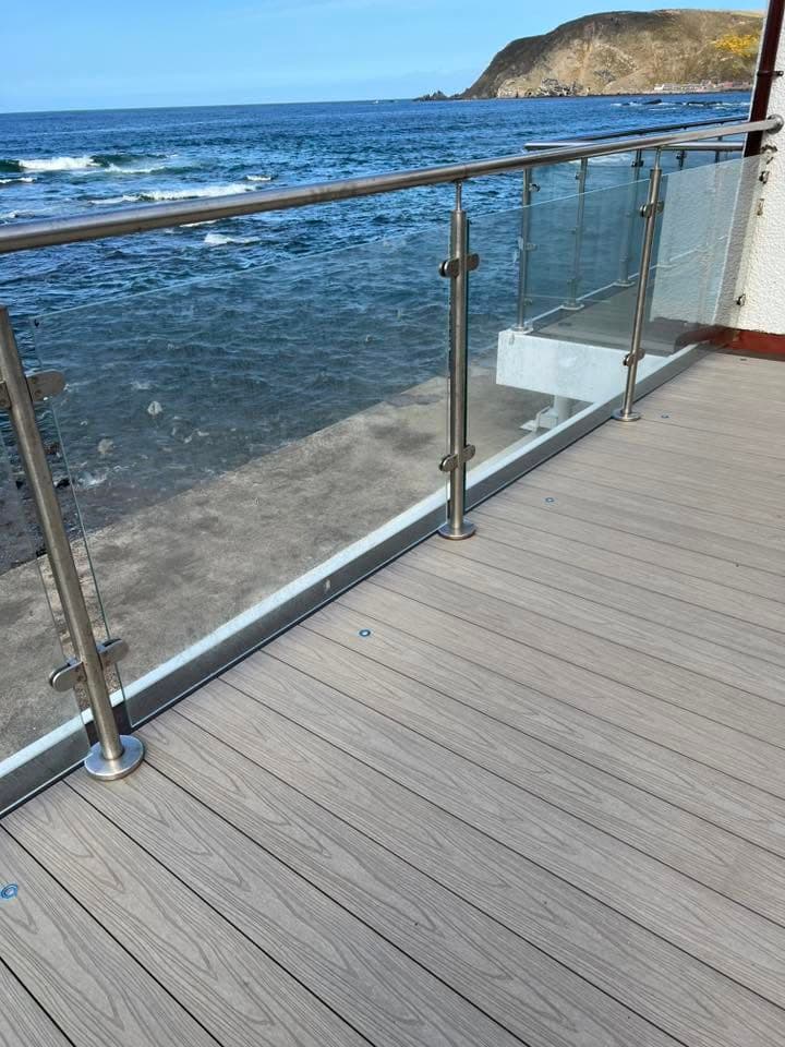Composite decking build with glass balustrade by Greenwell
