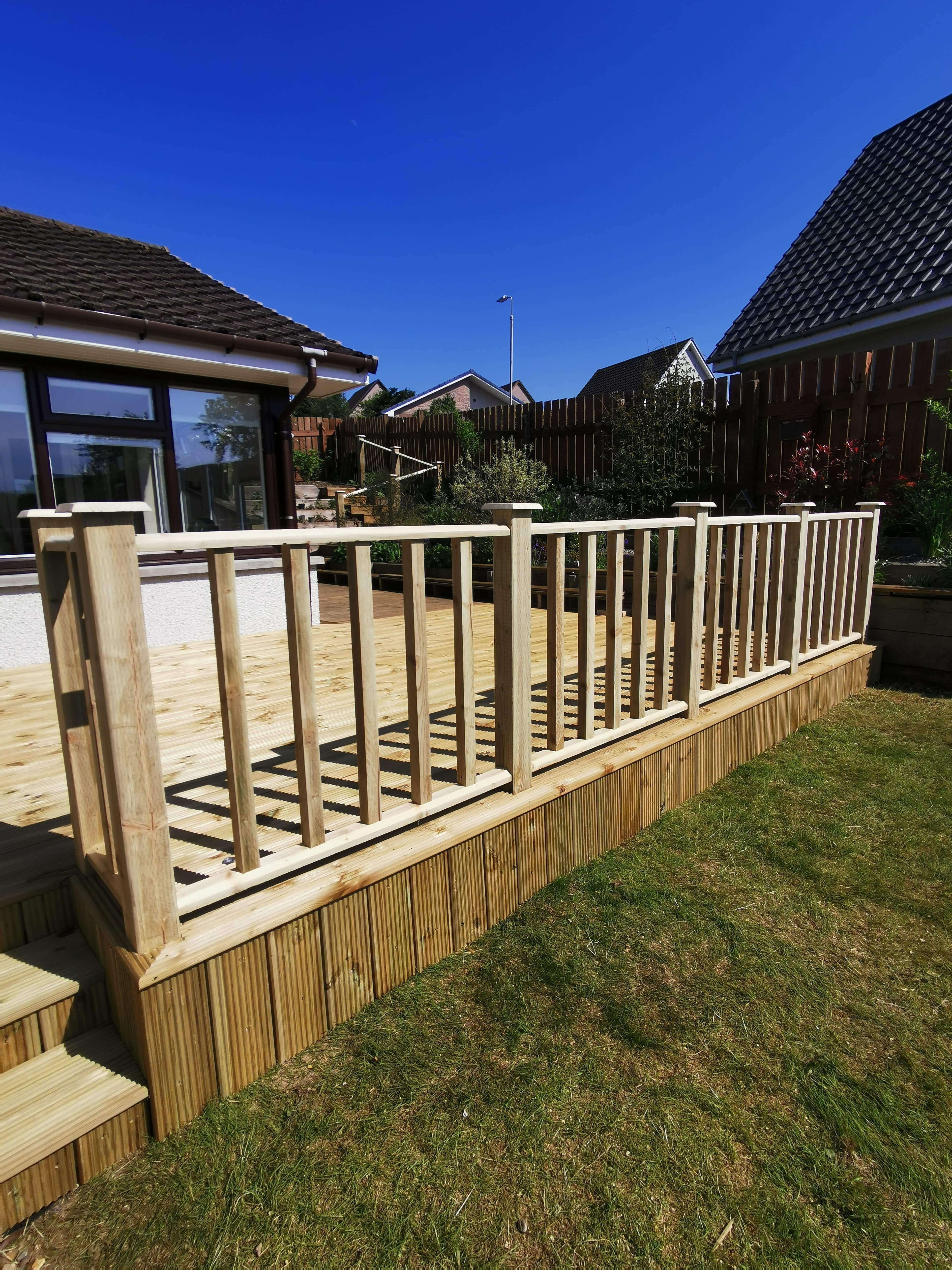 Raised decking with integrated planters