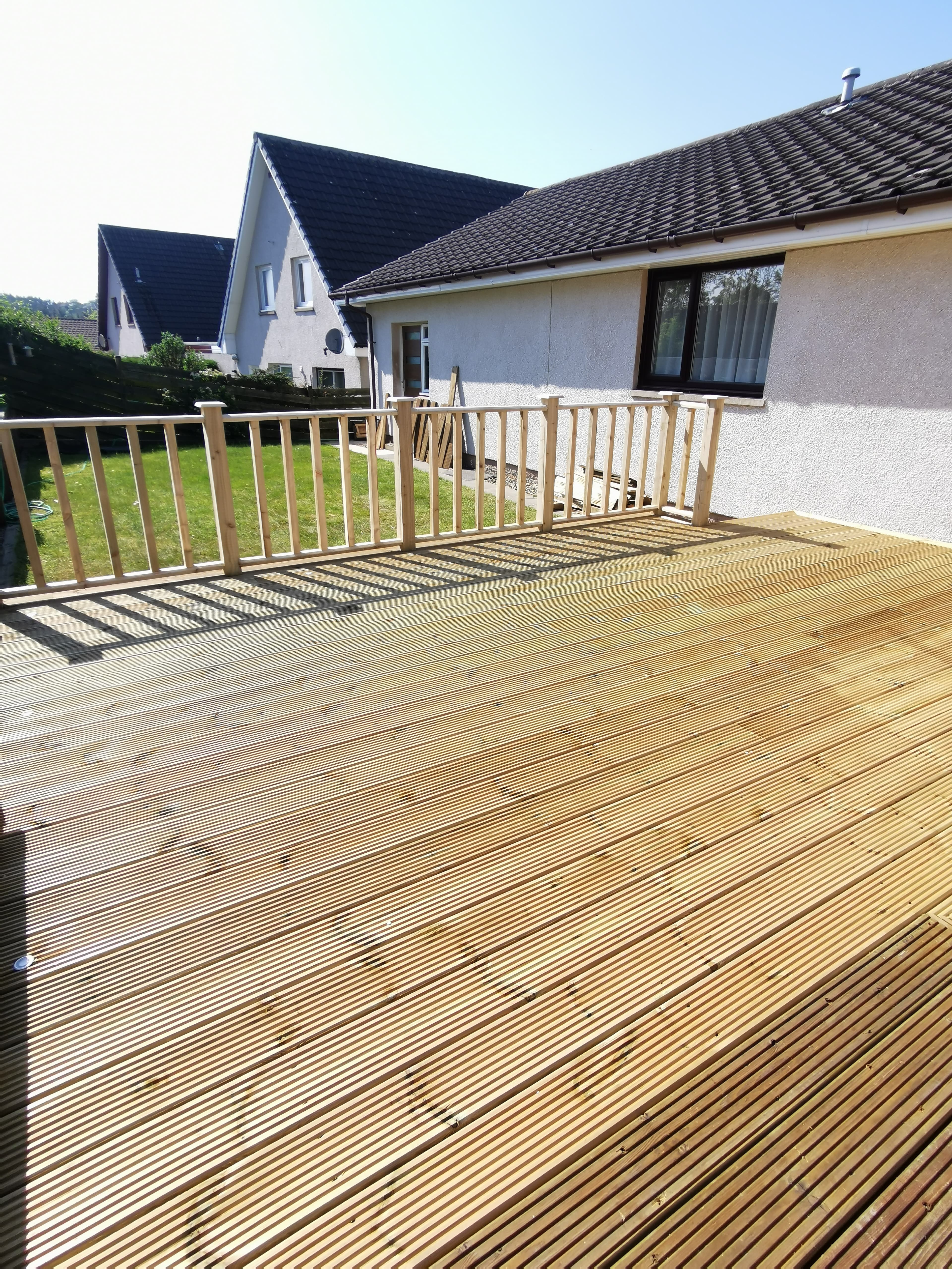 Composite decking build with glass balustrade by Greenwell