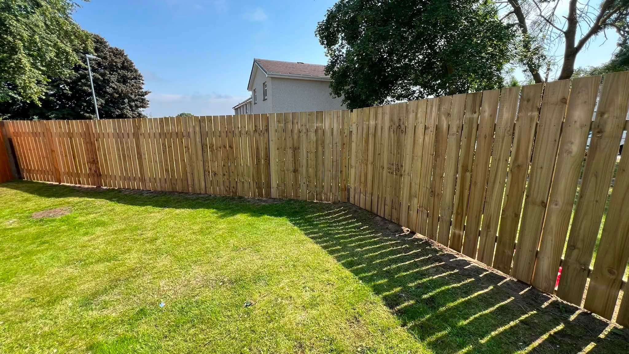 Slatted timber fencing installation