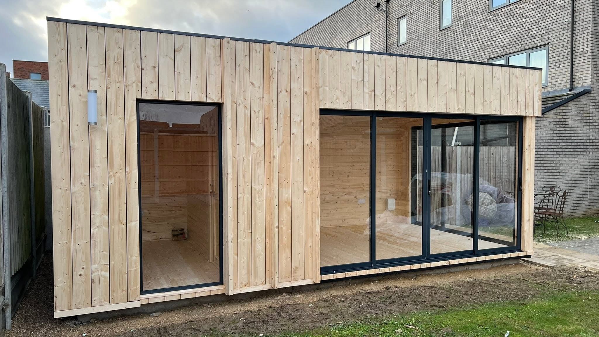 Composite-clad garden building at dusk