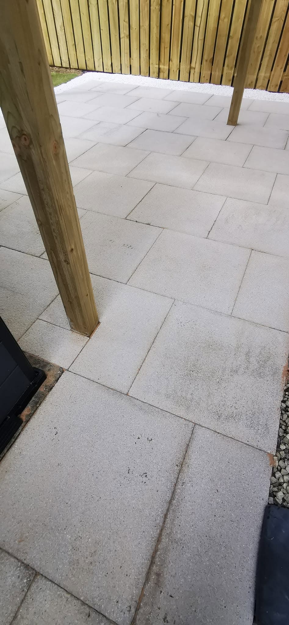 Tiered lawn and porcelain patio landscaping by Greenwell