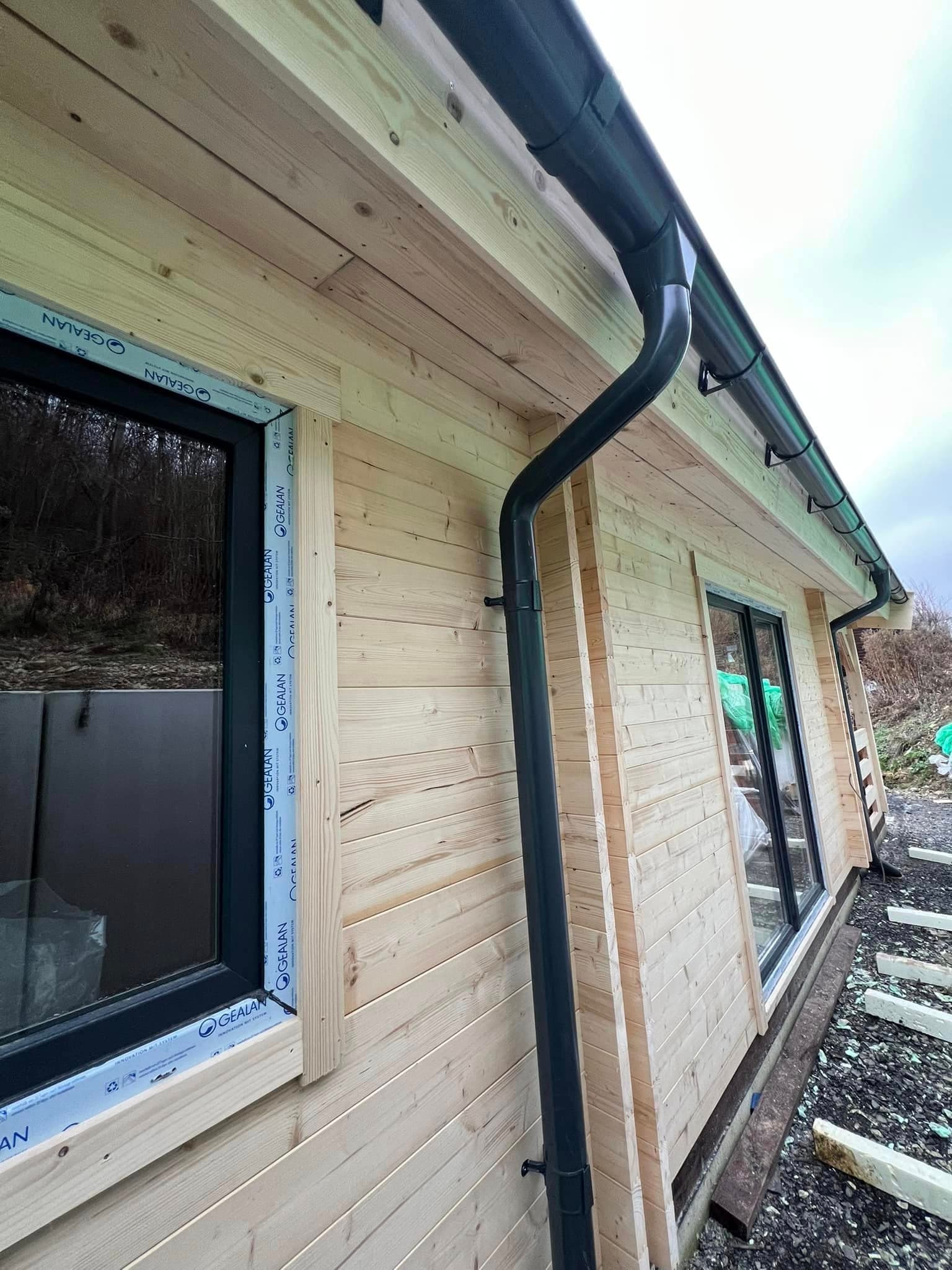 Twin-gable log cabin build by Greenwell