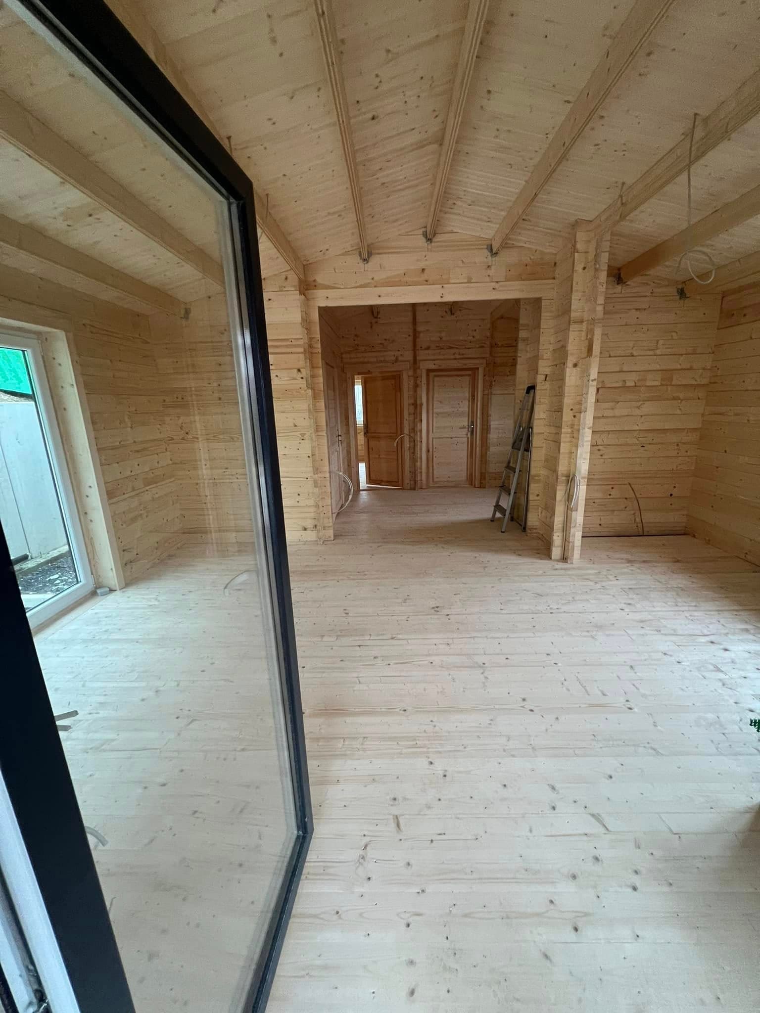Twin-gable log cabin build by Greenwell