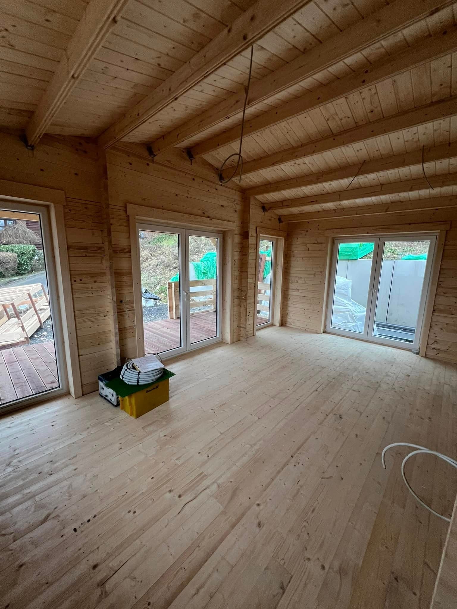 Twin-gable log cabin build by Greenwell