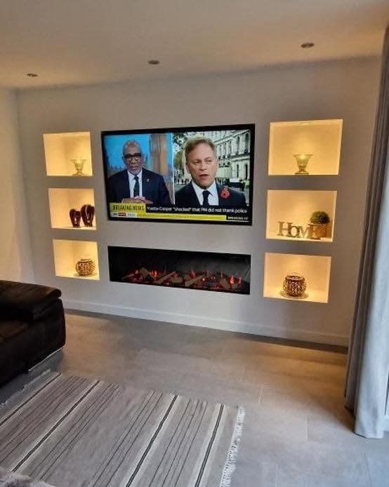Built-in media wall with recessed shelving and TV recess